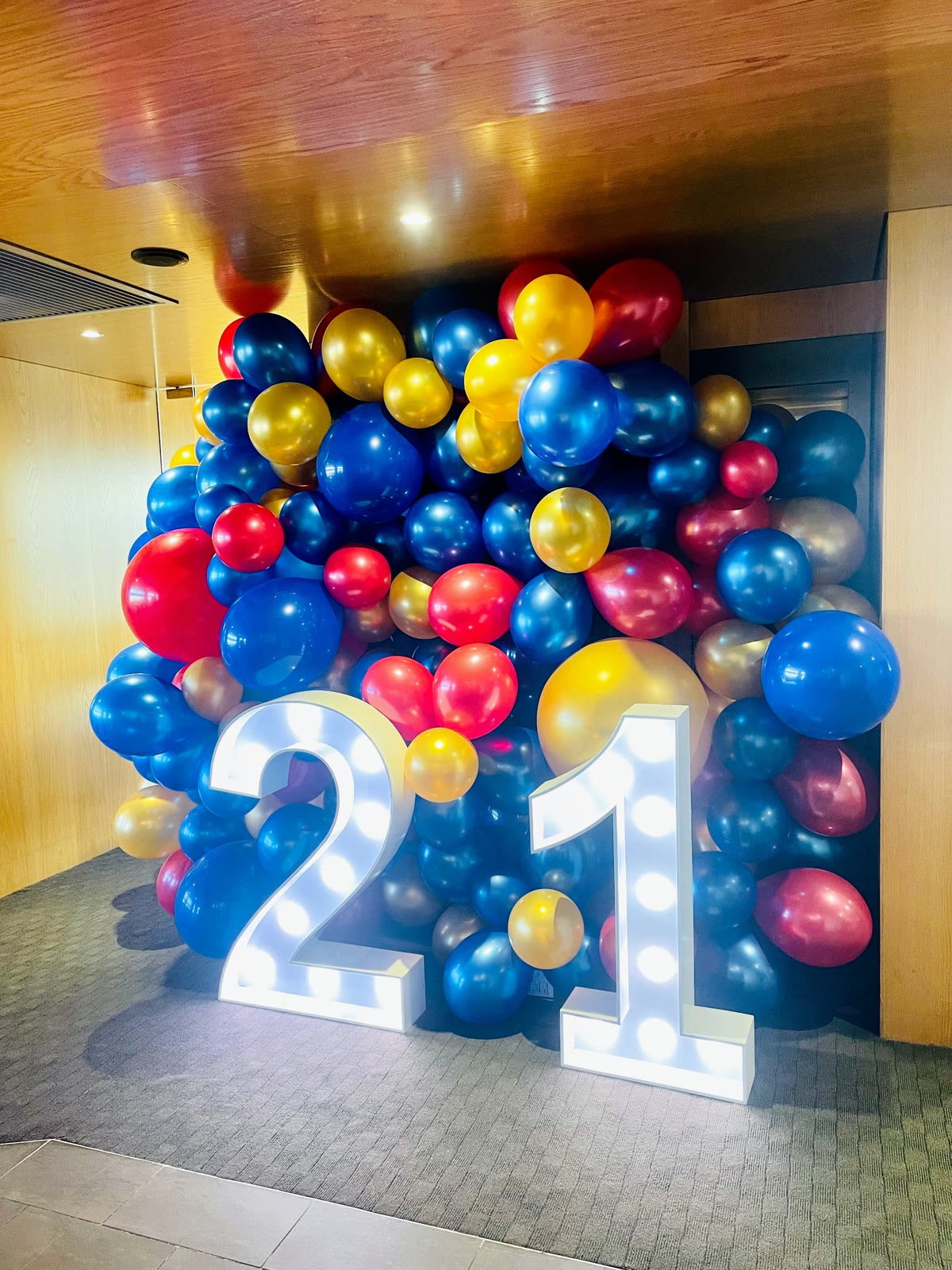 Blue, red and gold balloon wall